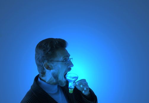 Man eating an electric lamp