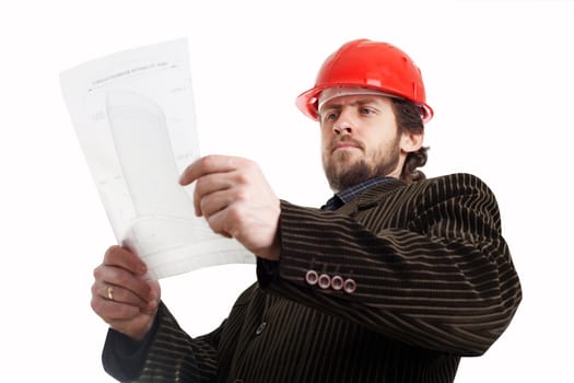 Construction foreman in red helmet checking drawings