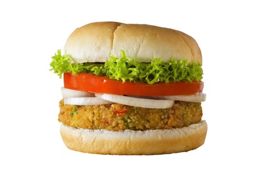A cheese-free vegetarian burger made from vegetables and breadcrumbs, stacked with onion rings, slice of tomato and curly lettuce, in a bap.  Isolated on white.