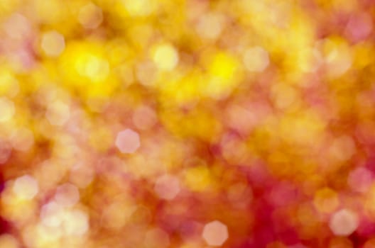 Soft, blurry, photographed bokeh background of pinks and yellows.  