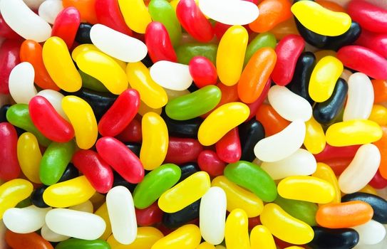 Bright, colourful filled frame background of gelatine-free jelly beans.  