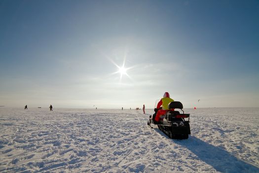 the snowmobile on a beautiful winter landscape