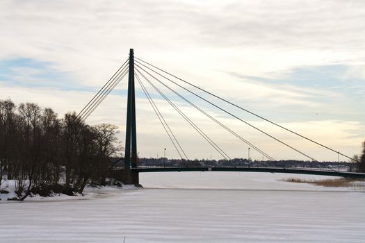 winter bridge scene with ice river