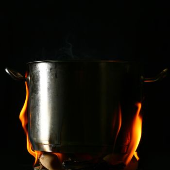 big pan and smoke on black