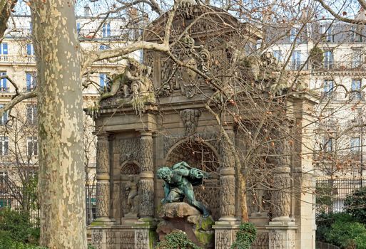 Medici fountain through the trees, statue of Polyphemus  Paris France
