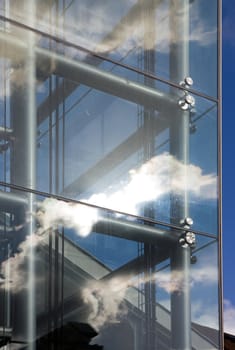 reflection of clouds in a glass staircase