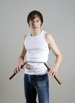 Martial Art. Man with nunchucks