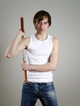 Martial Art. Man with nunchucks