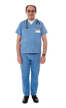 Full length view of senior doctor posing in front of camera