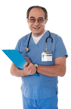 Experienced doctor holding reports and smiling at camera