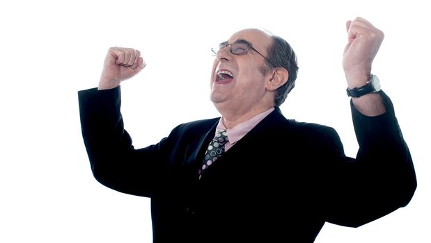 Successful old businessman shouting in excitement with arms up