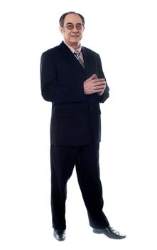 Smiling corporate person suited in black posing in front of camera