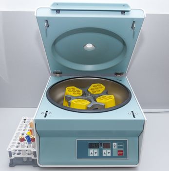 Medical equipment in hospital laboratory. Medical centrifuge to make certain type of investigation or analysis.