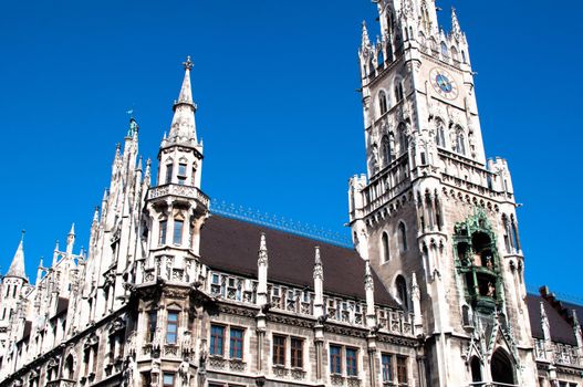 Munich City Hall ;Marienplatz (Town Hall) with its mechanical clock, or Glockenspiel, in Munich, Germany.