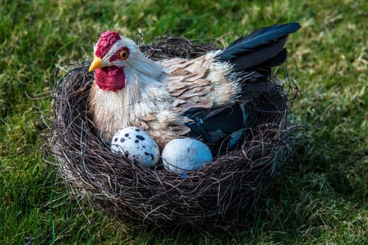Easter decoration: Hen and eggs in a nest