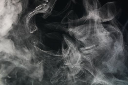 an abstract smoke picture in front of a black background