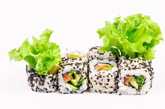 Sushi set with leawes salad on white background