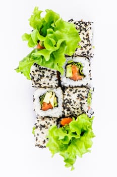 Sushi set with leawes salad on white background