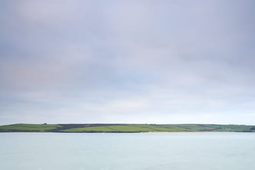 Cornish seascape shot in twilight. Motion blur in water.