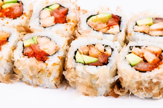 Sushi set with avocado, fish and red caviar on white background