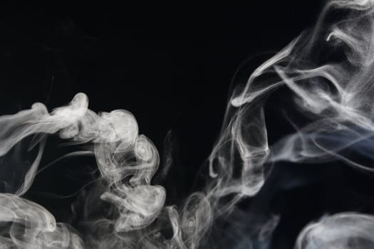 an abstract smoke picture in front of a black background