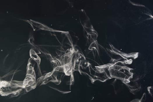 an abstract smoke picture in front of a black background