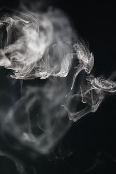 an abstract smoke picture in front of a black background