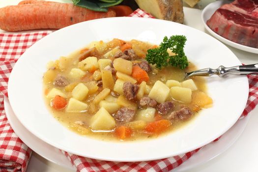 a plate of turnip stew with parsley and cook meat