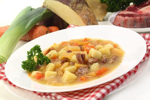 a plate of turnip stew with parsley and cook meat