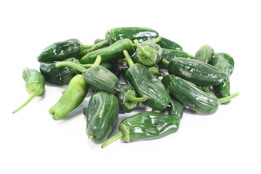 fresh green Pimientos on a light background