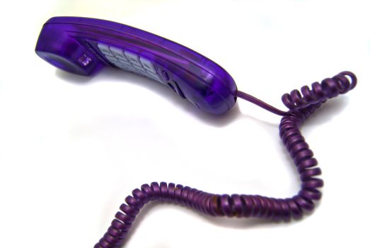 Purple phone handset on white background