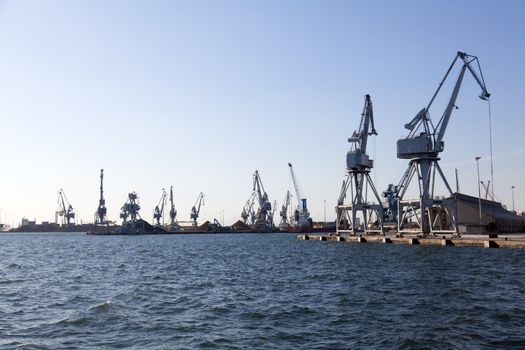 THESSALONIKI, GREECE - SEPTEMBER 29: Large cranes in the commercial section of the port of Thessaloniki working in the transport of products on September 29, 2011 in Thessaloniki, Greece