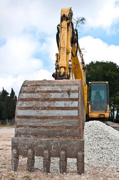 heavy machinery - arm of yellow excavator