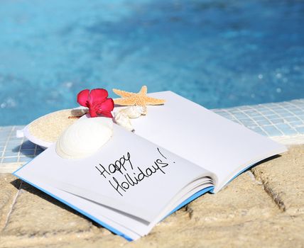 open book with strfish outdoor with swiming pool background