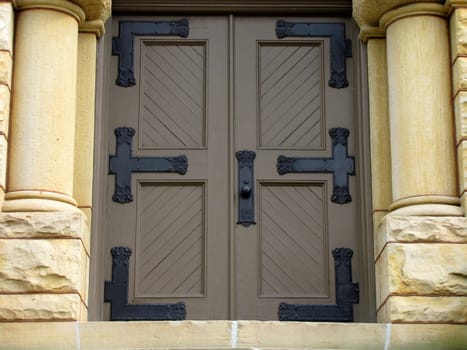 door to church entrance with pillars of stone on each side