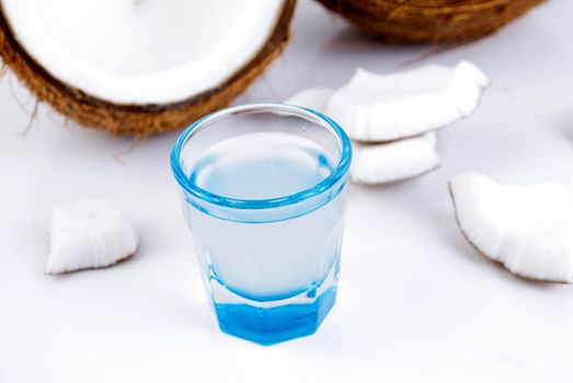 freshly cut coconut and milk isolated on white background
