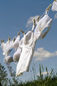 Female underwear on a clothesline towards blue sky