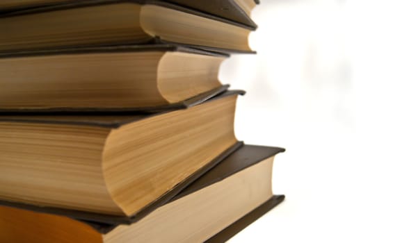 Stack of books close-up on white