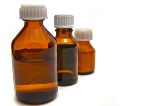 Three bottles of medicine on white background