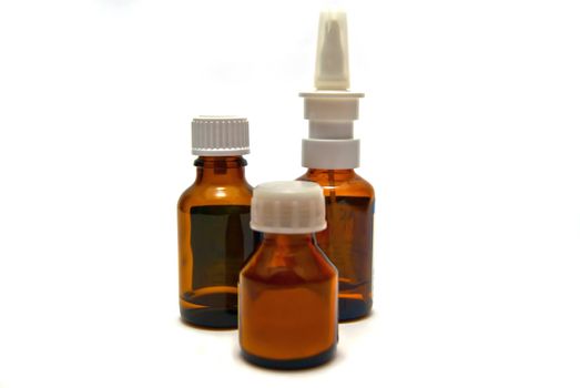 Three bottles of medication on white background