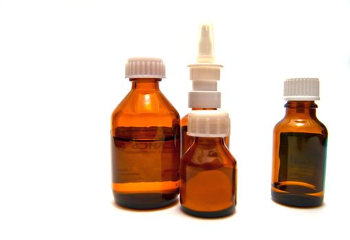 Four bottles of medicine on white background