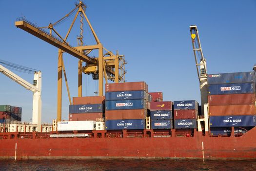 THESSALONIKI, GREECE - SEPTEMBER 29: Cranes load containers with products to ships in the port of Thessaloniki on September 29, 2011 in Thessaloniki, Greece