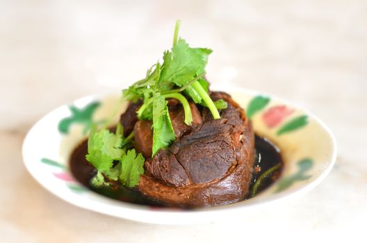 Pork shank cooked  in soya sauce, with preserved vegetable,  famous chinese dish