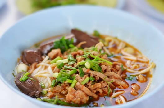  rice noodles with spicy pork sauce , Thai cuisine