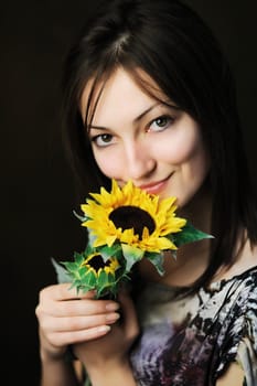 An image of a beautiful woman with sunflower 