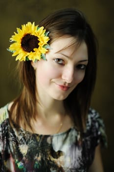 A beautiful woman with sunflower in her hair