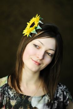 A beautiful woman with sunflower in her hair