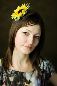 A beautiful woman with sunflower in her hair