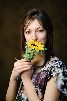 An image of a beautiful woman with sunflower