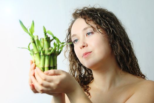 Stock photo: an image of a nice woman with bamboo